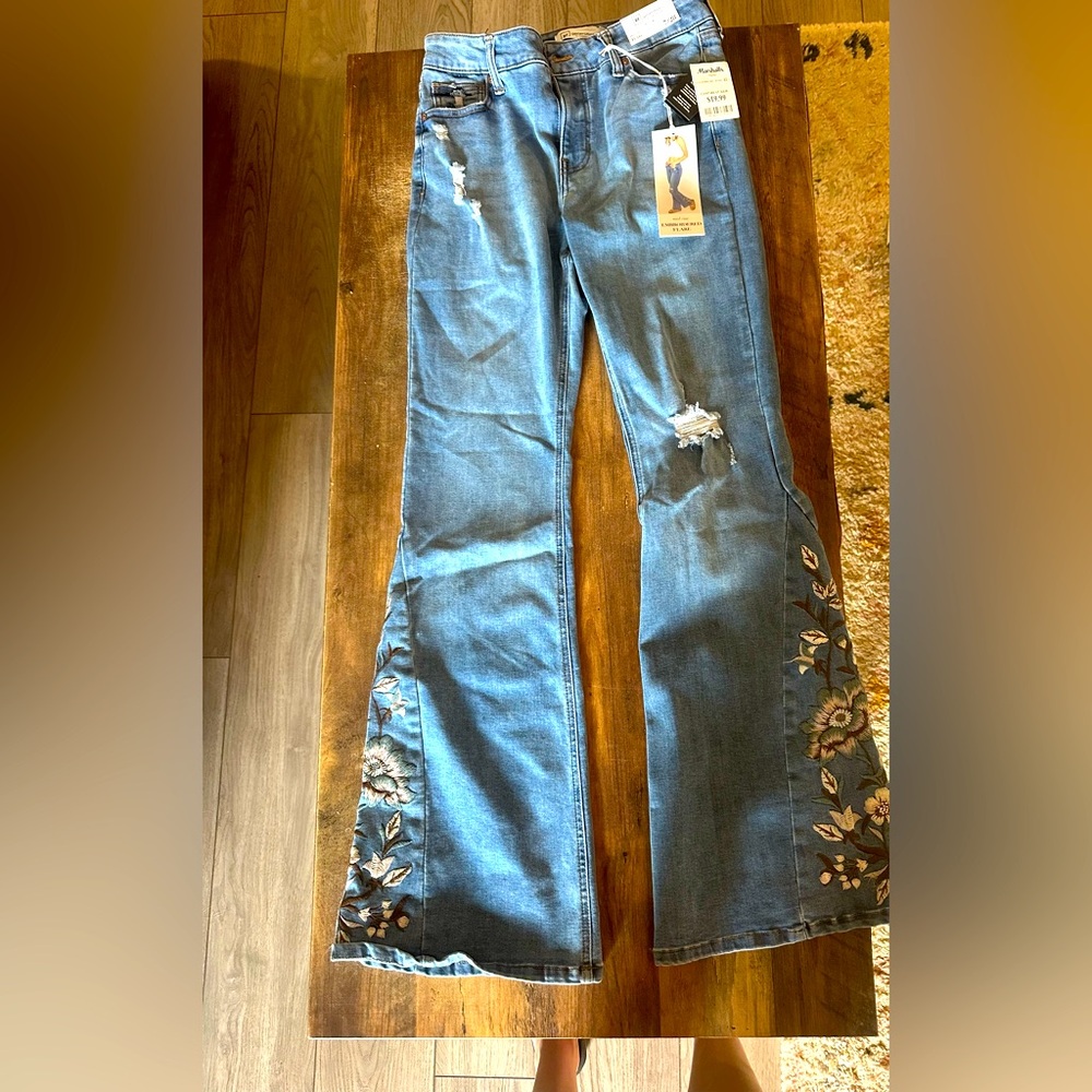 Re-generation mid-rise flare jeans with embroidered flowers at bottom